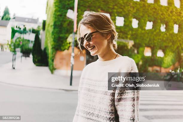 woman walking in the city - norway city stock pictures, royalty-free photos & images