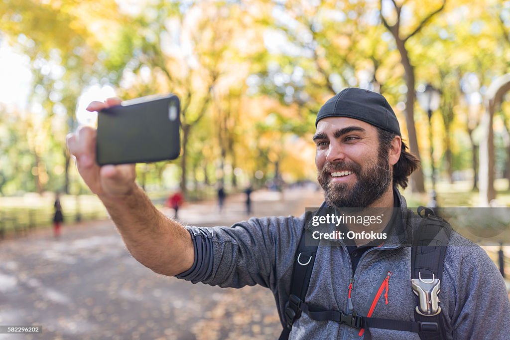 Man Taking a Selfie in Central Park, New York City