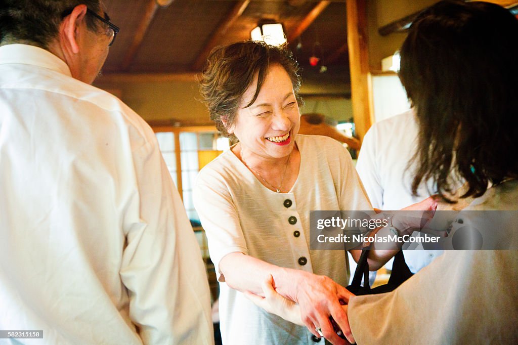 Mature Japanese female greeting an old friend