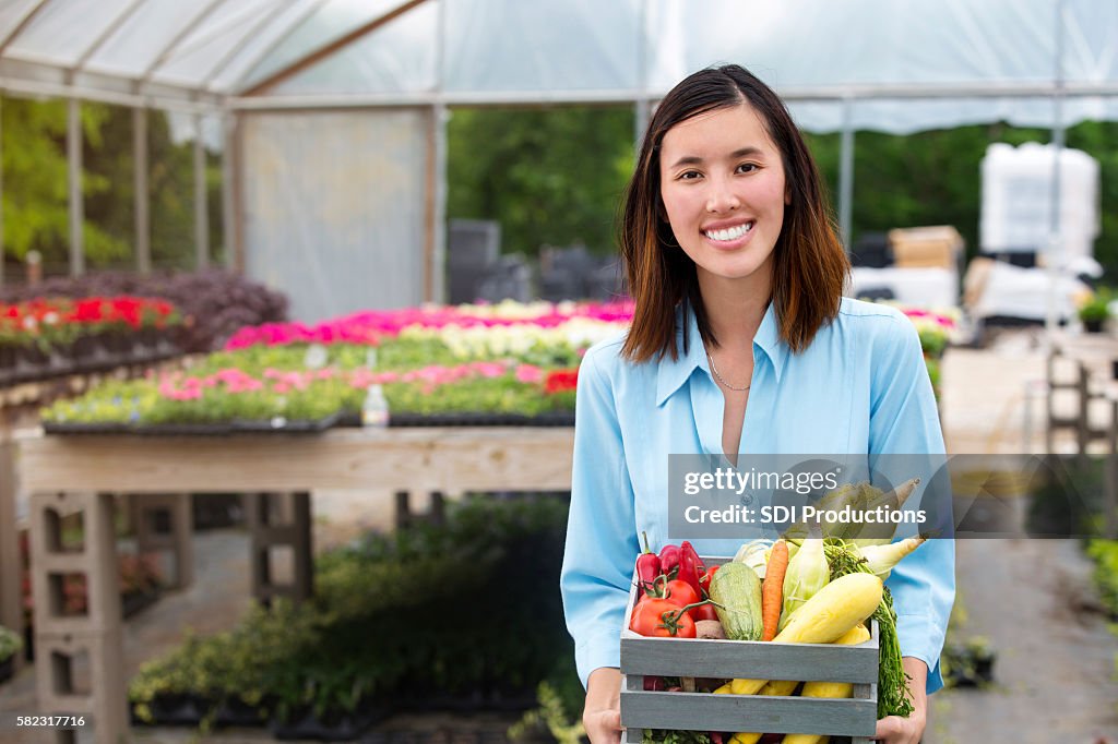 Woman purchases fresh veggies at farmer's market