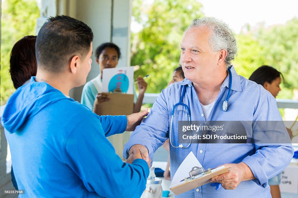 Doctor Introduction Options Doctor Introducing Himself To Patient At Temporary Free Shot Clinic ...