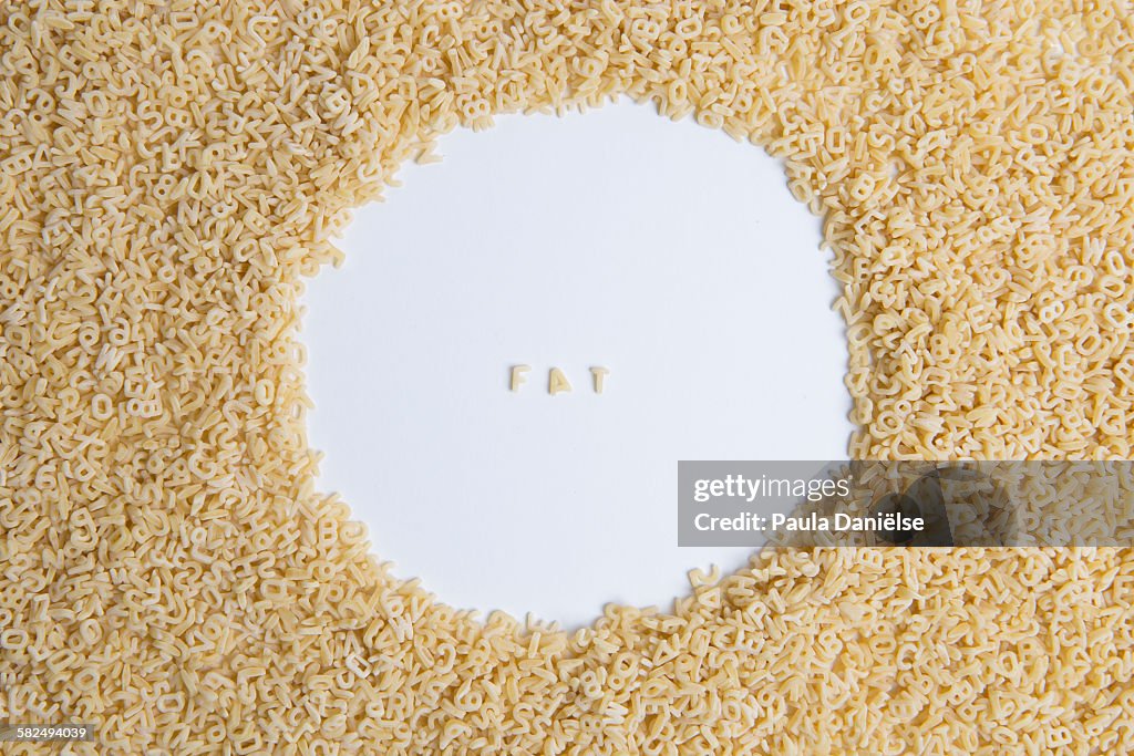 FAT spelled in letter pasta