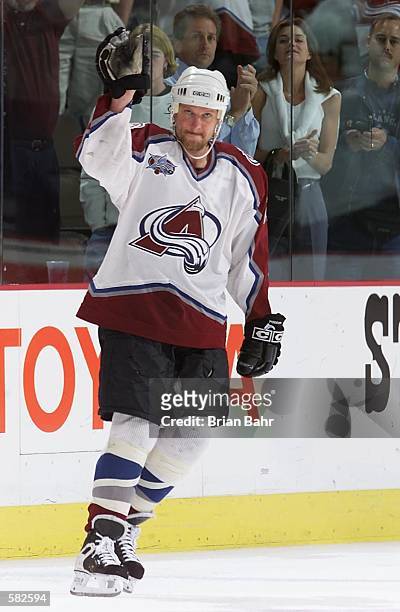 Shjon Podein waves to the crowd after defeating the St. Louis Blues 4-2 during game two of the Western Conference Finals at the Pepsi Center in...