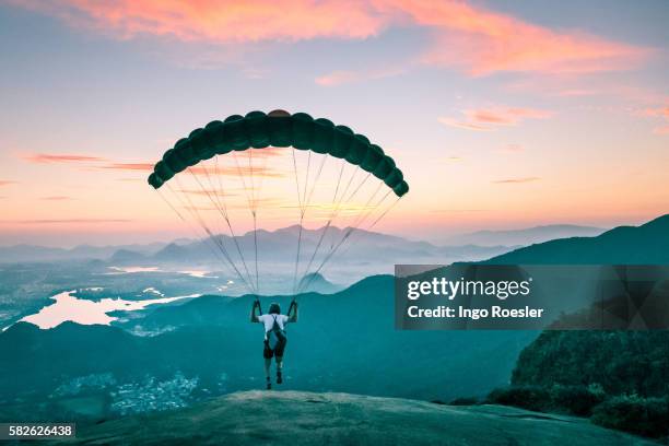 paraglider taking off - paragliding stock pictures, royalty-free photos & images