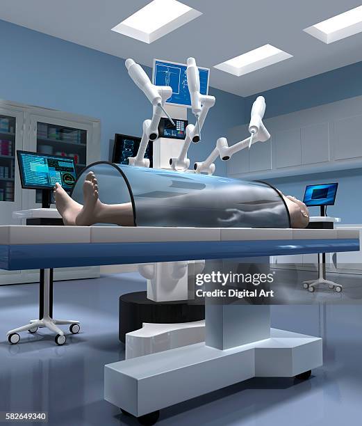 surgical robot operating on dummy - robotic surgery stock pictures, royalty-free photos & images