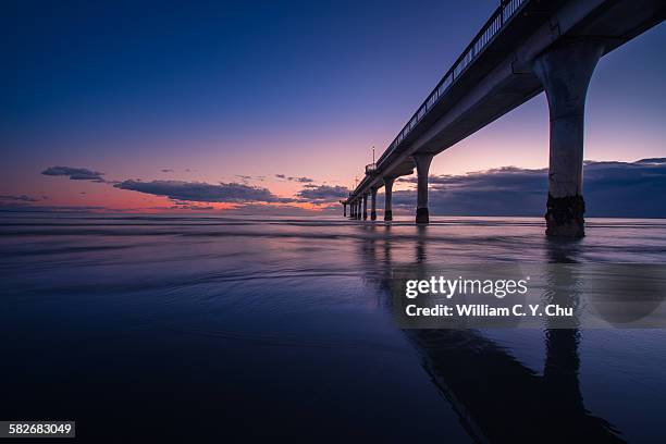 sunrise at new brighton pier - christchurch fotografías e imágenes de stock