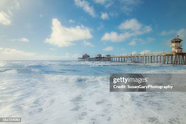 huntington beach pier after storm - huntington beach foto e immagini stock