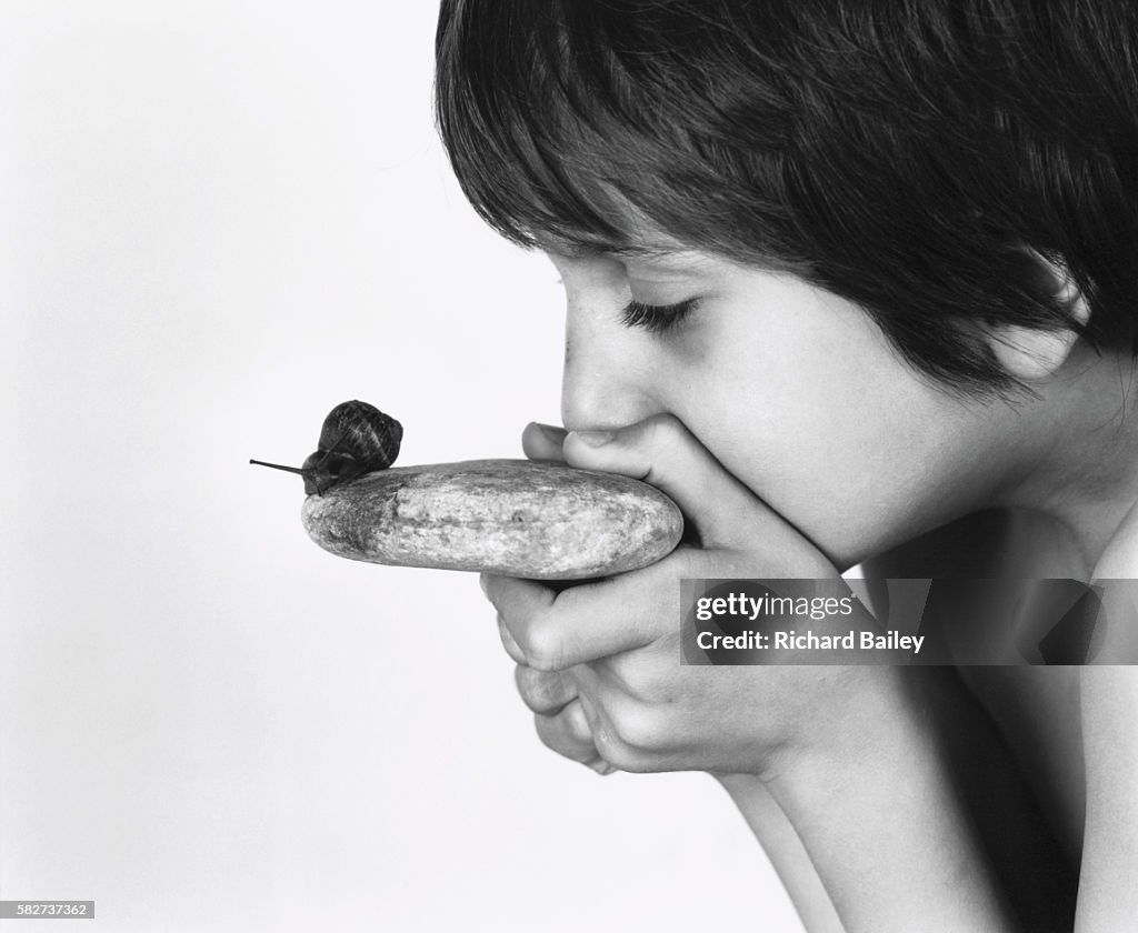 Boy Looking at a Snail