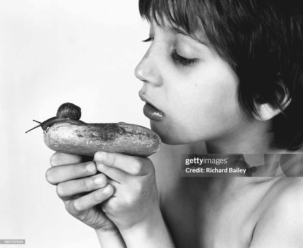 Boy Looking at a Snail