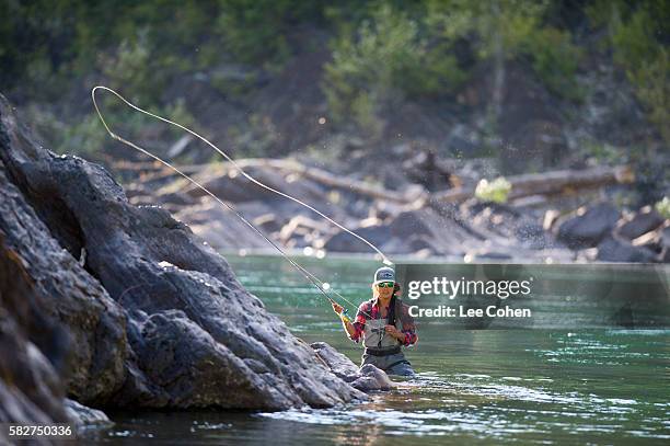 woman fishing on the flathead river, montana - casting stock pictures, royalty-free photos & images