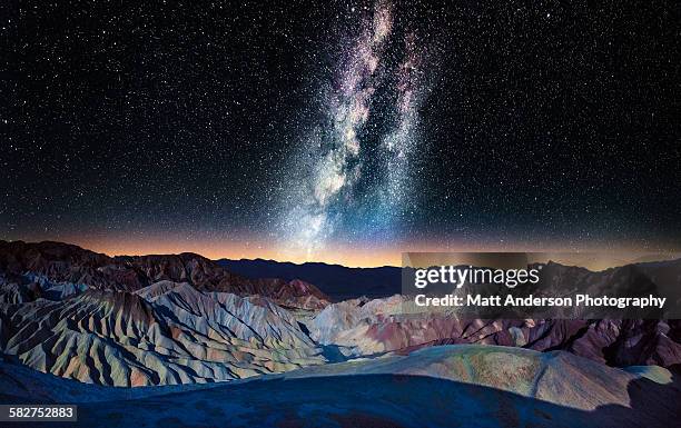 the milky way over zabriskie point, death valley - death valley stock-fotos und bilder