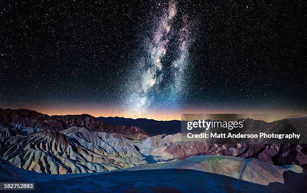 the milky way over zabriskie point, death valley - death valley national park stock pictures, royalty-free photos & images