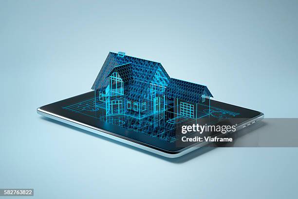 family house sitting on tablet pc - home concept stock pictures, royalty-free photos & images