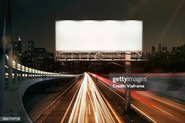 city billboard - billboard night road stock pictures, royalty-free photos & images