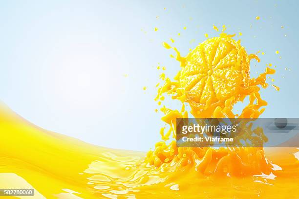 slice of orange splashing into orange juice - orange juice stock pictures, royalty-free photos & images