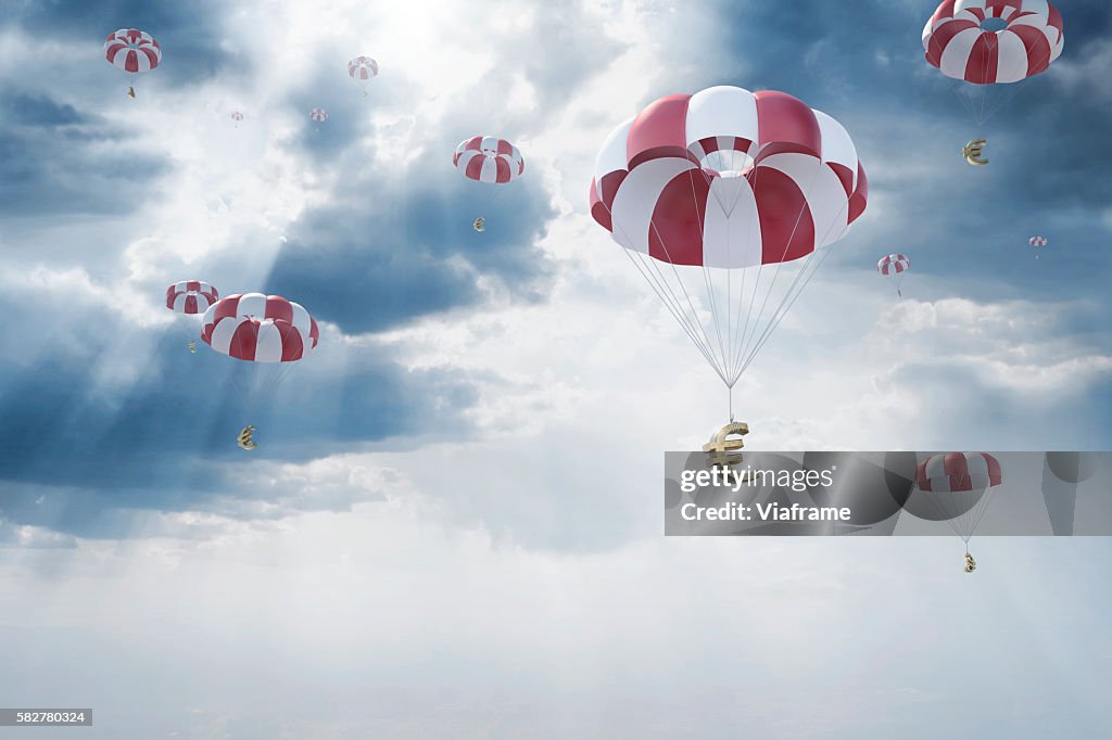 Parachutes with euro sign falling from sky