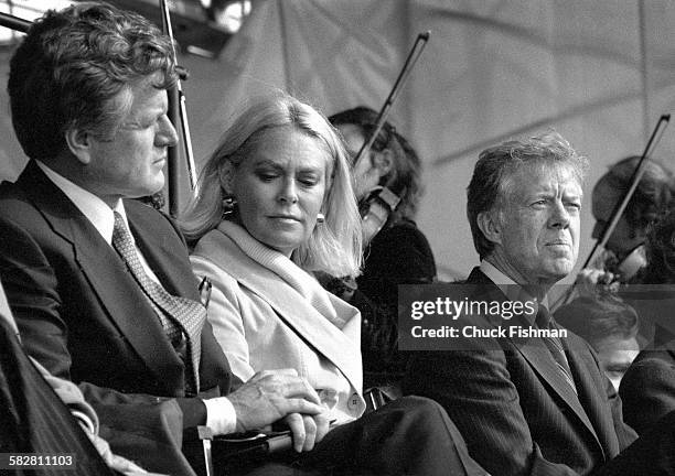 American President Jimmy Carter, right, sits with Senator Ted Kennedy, left, and his wife Joan, center, at the memorial dedication ceremony for the...