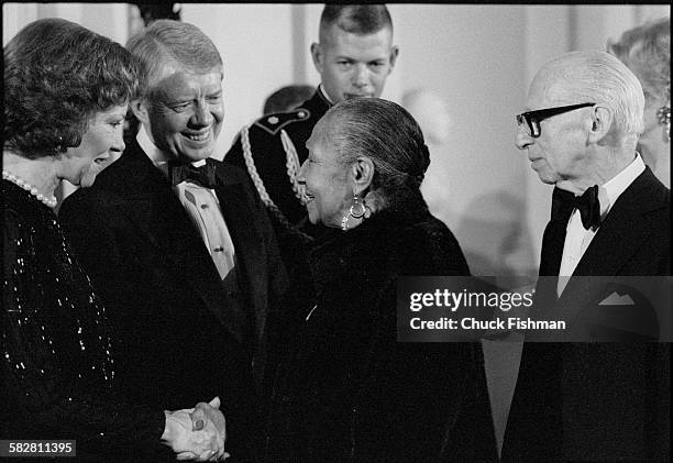 First Lady Rosalynn Carter shakes hands with 84 year old Blues singer Alberta Hunter who had recently made a comeback from obscurity, at a White...