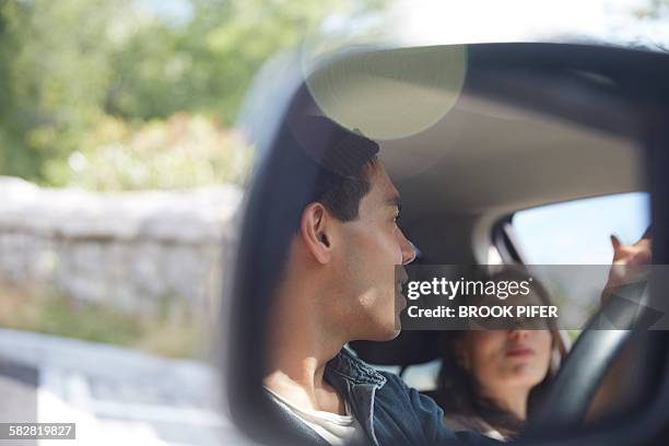 two young adults exploring nature on road trip - asian couple car stock pictures, royalty-free photos & images