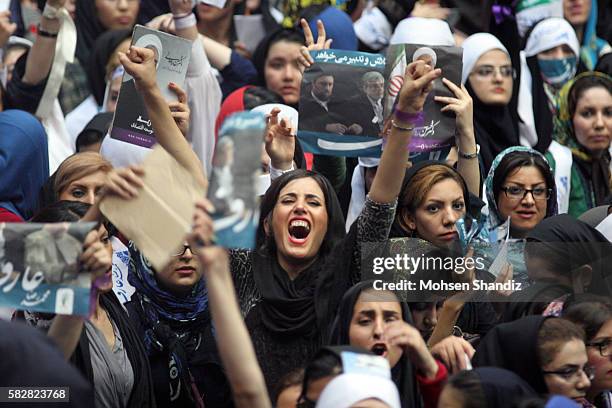 Iranian supporters of first vice president and reformist presidential candidate, Mohammadreza Aref shout slogans during his campaign rally in Tehran...