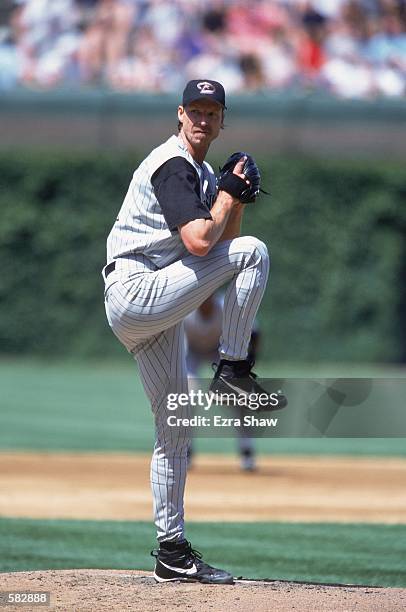 Randy Johnson of the Arizona Diamondbacks winds back to pitch the ball during the game against the Chicago Cubs at Wrigley Field in Chicago,...