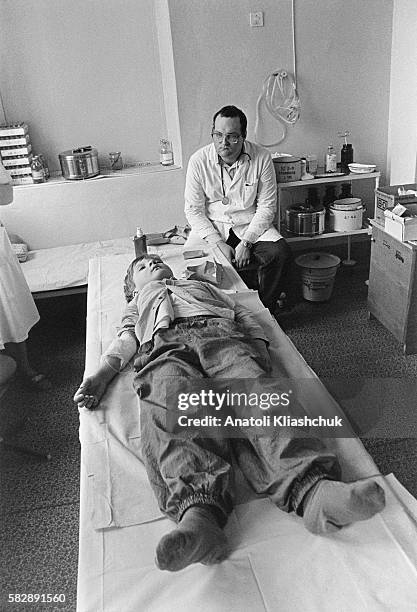 Sergei, aged 9, in the waiting room at the emergency section of the Minsk hospital.