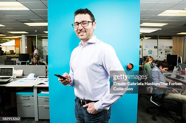 Nest's Matt Rogers in front of his $249 smart thermostat.