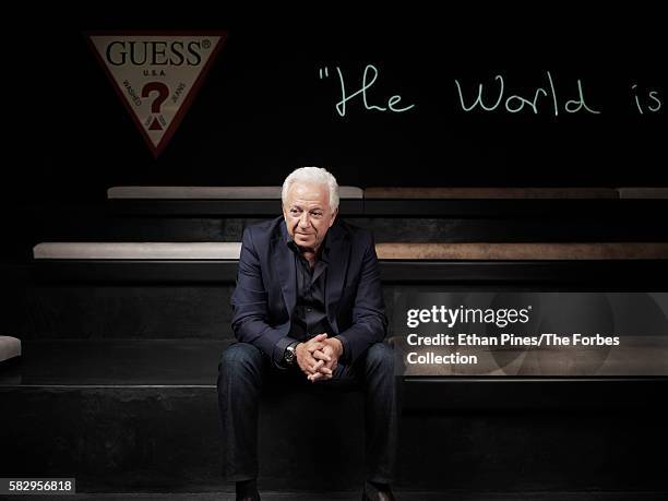 Guess co-founder Paul Marciano at the Guess headquarters in Los Angeles, CA. The neon sign says, "The world is our field" in Paul's handwriting.