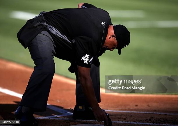 Home plate umpire Kerwin Danley works during the game between the Tampa Bay Rays and Oakland Athletics at the Oakland Coliseum on Saturday, July 23,...