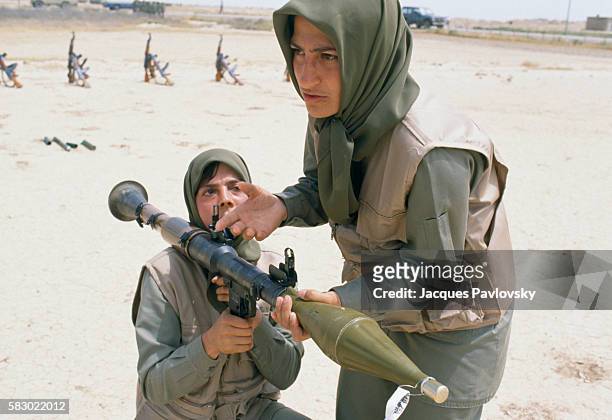 An instructor of the NLA , talks during a bazooka training exercise at a camp east of Baghdad, Iraq. The NLA is the armed wing of the Mujahideen...