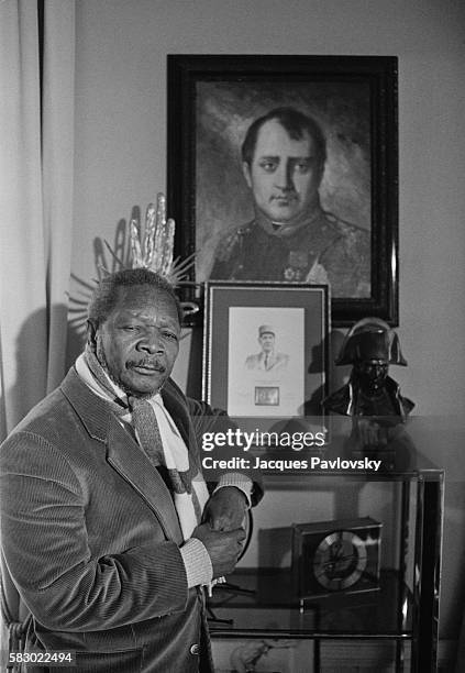 Former President and self-proclaimed Emperor of Central African Republic Jean Bedel Bokassa poses with a portrait of Napoleon I as he organizes a...