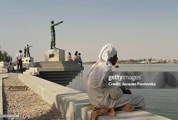 Soldiers point accusatory fingers towards Iran at a monument dedicated to soldiers who fought in the Iran-Iraq war along Chatt-al-Arab in Basra.