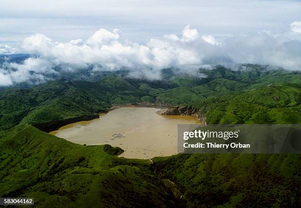 The waters of Lake Nyos near Wum, Cameroon, have turned a murky brown following a deadly release of toxic gas. In August of 1986, the lake, which is...