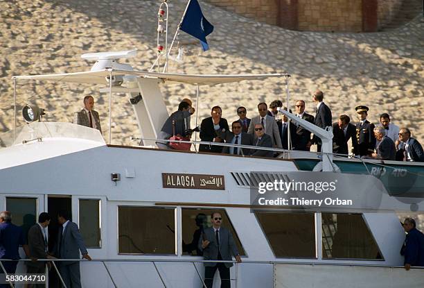 French President Francois Mitterrand meets with Egyptian President Hosni Mubarak, on board the Alaqsa yacht, during a state visit to Cairo.