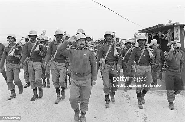Sudanese volunteer soldiers marching during training operations for the Iraqi armed forces near Baghdad on February 20, 1983. | Location: near...