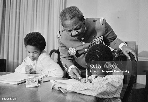 Former President and self-proclaimed Emperor of Central African Republic Jean-Bedel Bokassa wears his uniform of Marechal with his sons as he...
