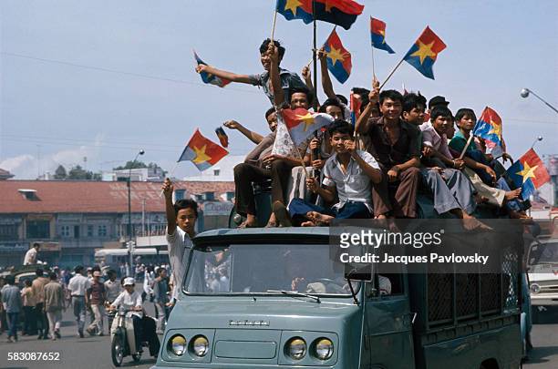 Vietnamese celebrate after the fall of Saigon.