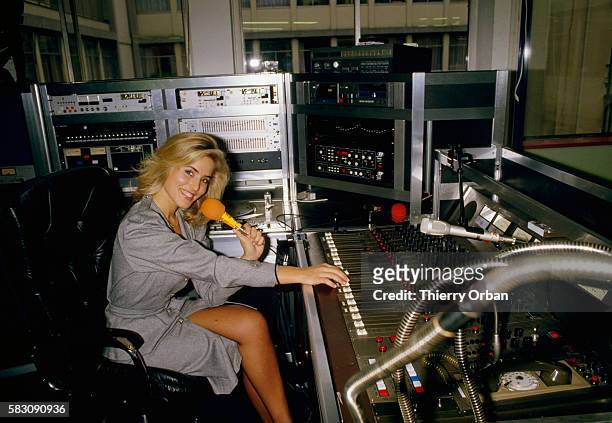 Sophie Favier, a former "Cocogirl" on the French television show Cocoricocoboy, sits in a recording studio in Paris. Favier became a game show...
