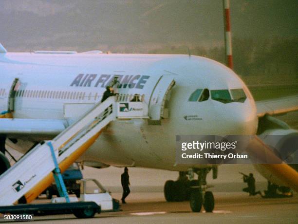 French police storm the Air France Airbus A300, which was hijacked by four Algerian terrorists with the GIA , at Marseilles Marignane Airport and...