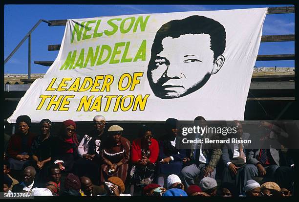 Nelson Mandela Banner at the funeral of nine people killed during the August 28 Gugulethu riots.. | Location: Gugulethu, South Africa.