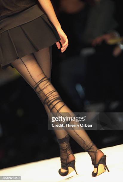 Turkish designer Ece Ege of Dice Kayek shows her women's 2002 spring-summer ready-to-wear line in Paris. The model is wearing baggy hose under a...