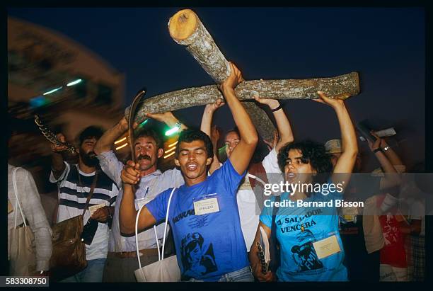 Carrying a rough-hewn wooden cross, delegates from the ecclesial base communities of Liberation Theology come together for their sixth meeting,...