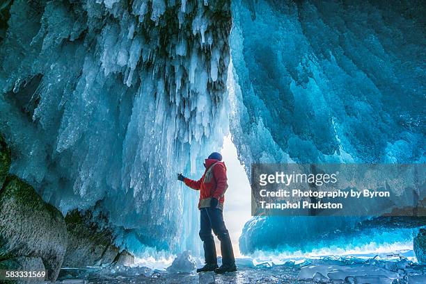 ice cave expolorer - baikal stock-fotos und bilder