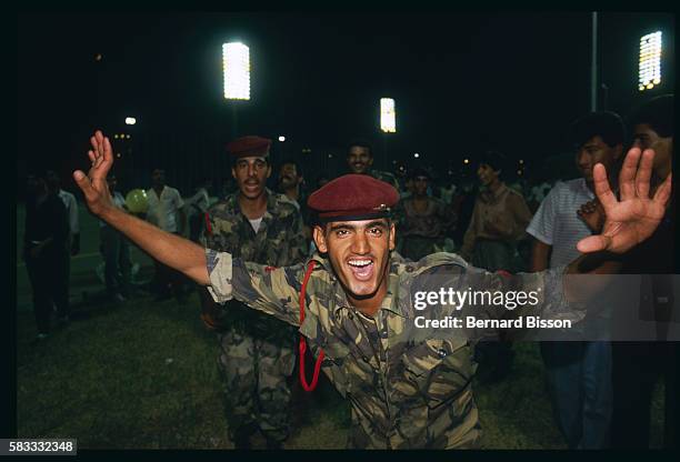 An elated Iraqi soldier celebrates at Baghdad Stadium after the arrival of United Nations peacekeeping forces signaling the long-awaited ceasefire...