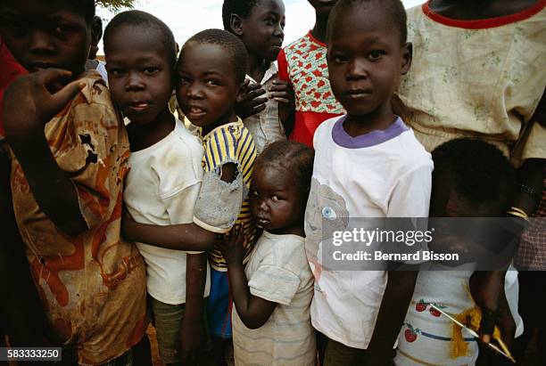 Children receive food and medical treatment at a refugee camp in Juba, Sudan. Widespread famine and civil war have ravaged Sudan for decades,...