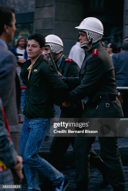 Czechoslovakian police officers arrest a young protester in Prague during the celebration of the 70th anniversary of the creation of the Czech state....