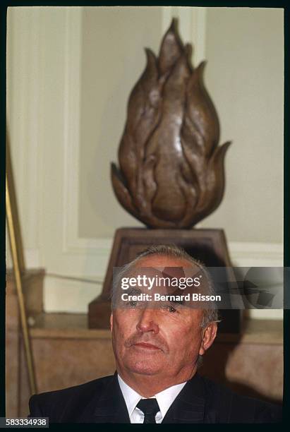 On a visit to France, former Nazi SS officer and leader of the German far-right wing political party Republikaners, Franz Schonhuber, sits beneath a...