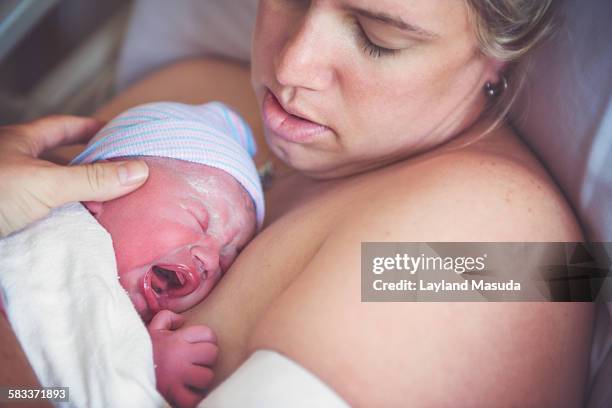 first minutes - moms crying in bed stock pictures, royalty-free photos & images