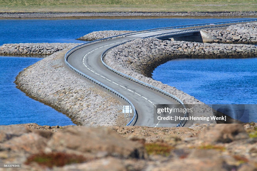 Winding road across river