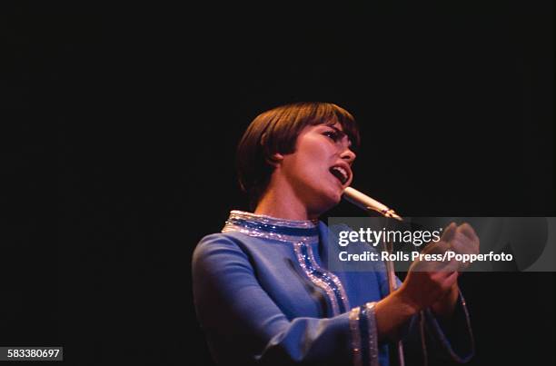 French singer Mireille Mathieu rehearses on stage before her appearance on the Royal Variety Show at the London Palladium in December 1967.